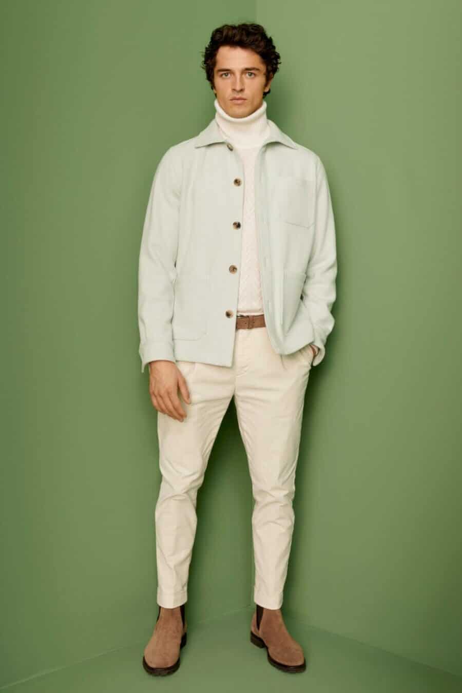 Men's all white outfit with white jeans, turtleneck and jacket