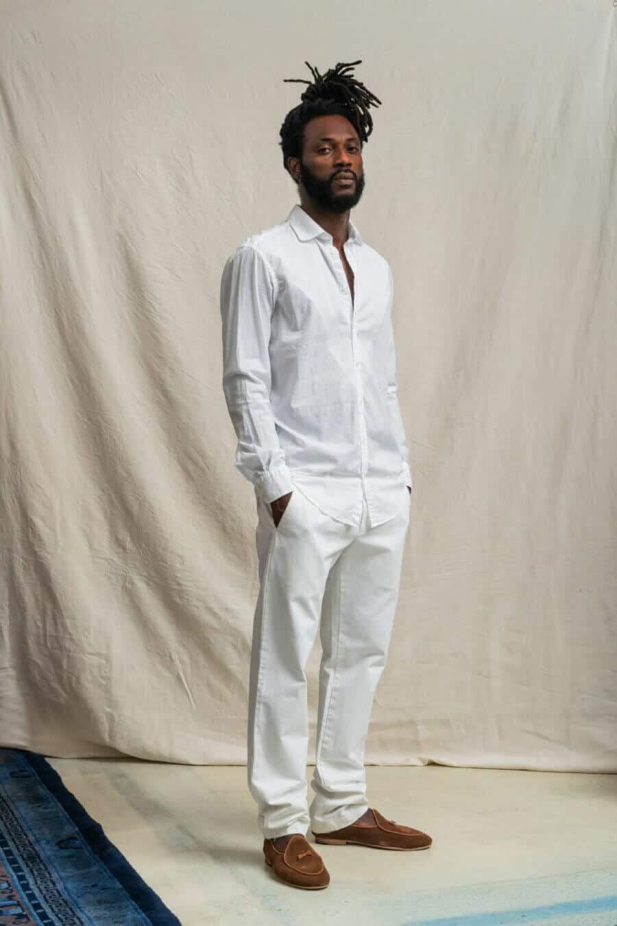 Men's all white shirt and trousers outfit with suede loafers