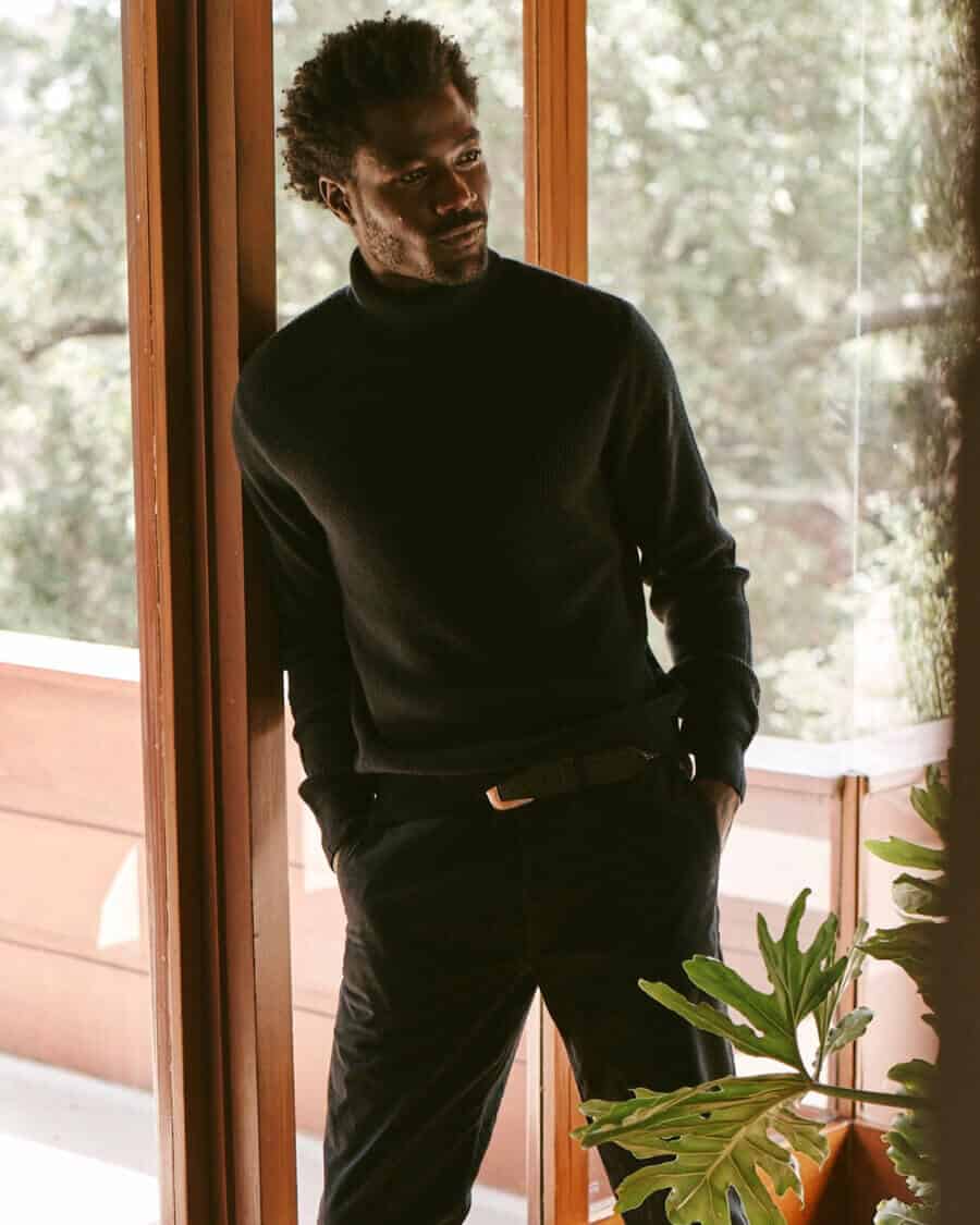 Men's All black outfit of turtleneck and black chinos
