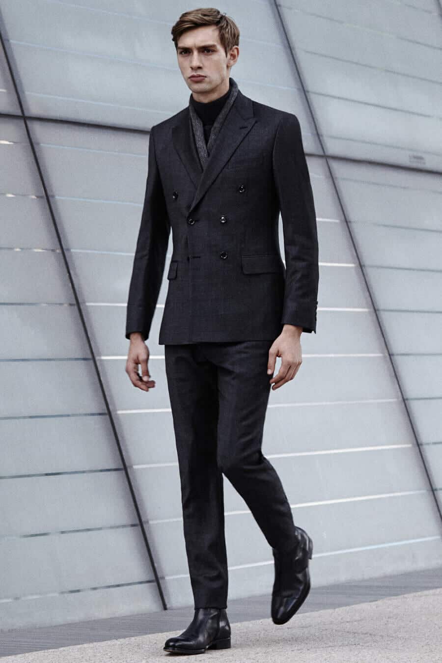 Men's charcoal suit with black boots and black turtleneck outfit