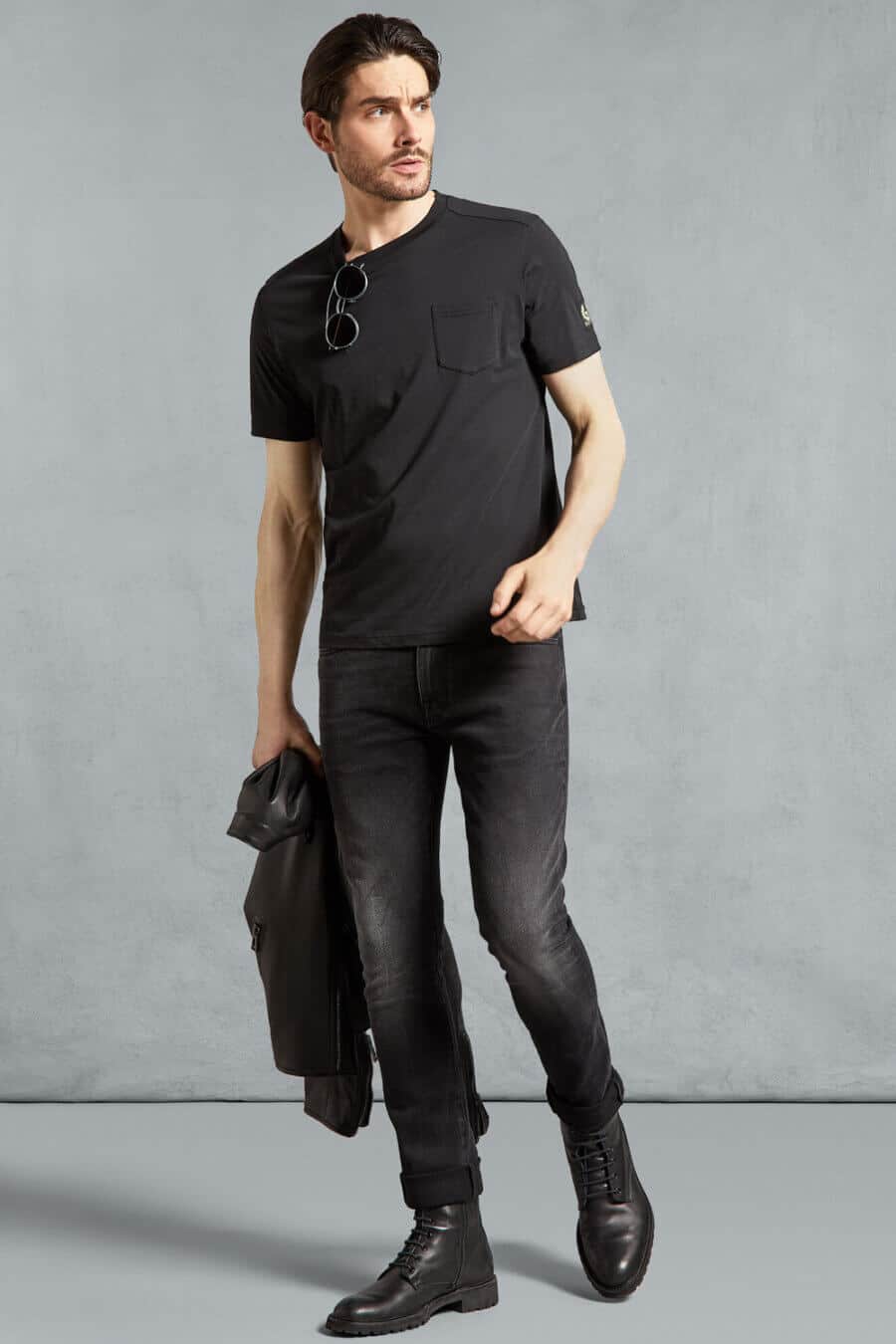 Men's simple all black outfit with t-shirt, jeans, boots and leather jacket