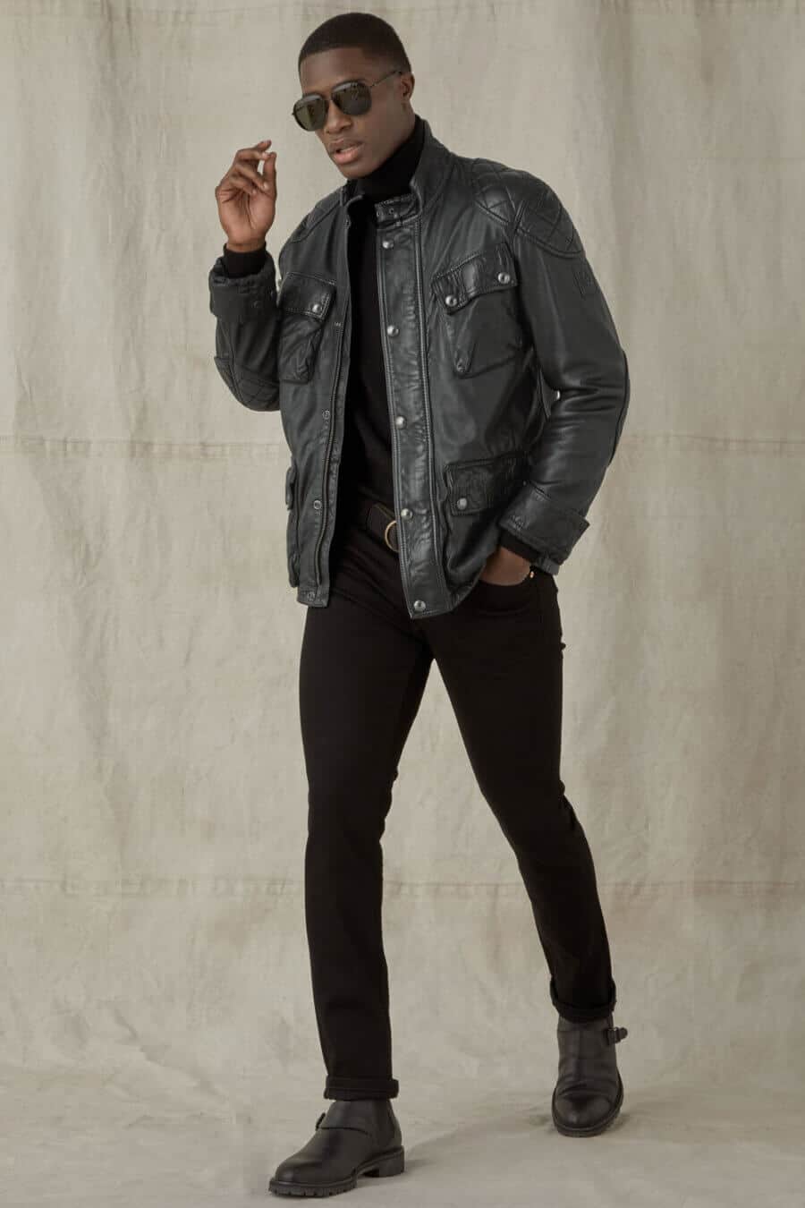 Men's all black outfit with leather motorcycle jacket, jeans and biker boots