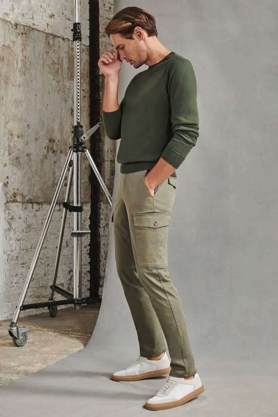 Men's slim green cargo pants with green sweatshirt and white sneakers outfit