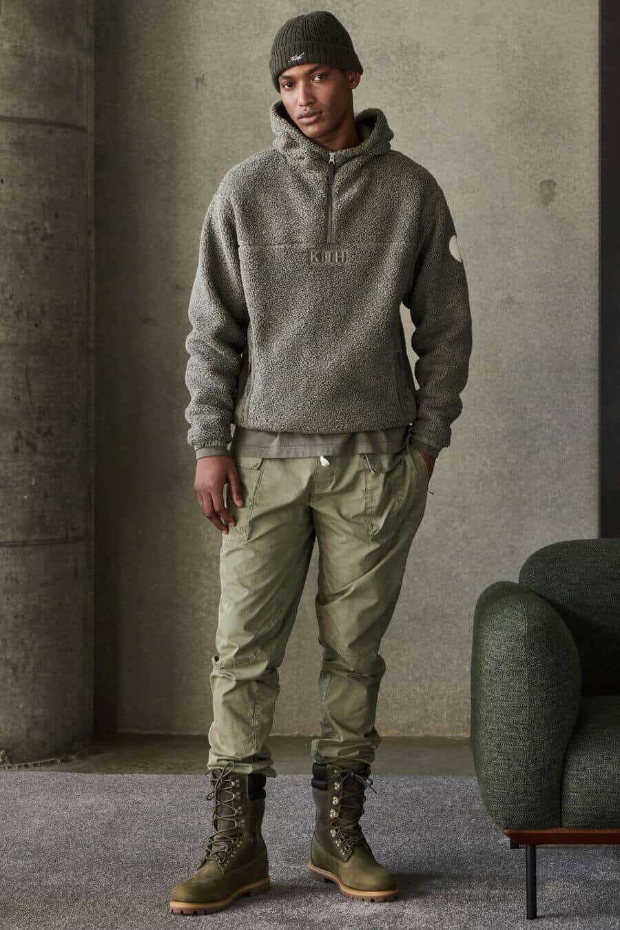 Men's green utility pants with a fleece and boots streetwear outfit