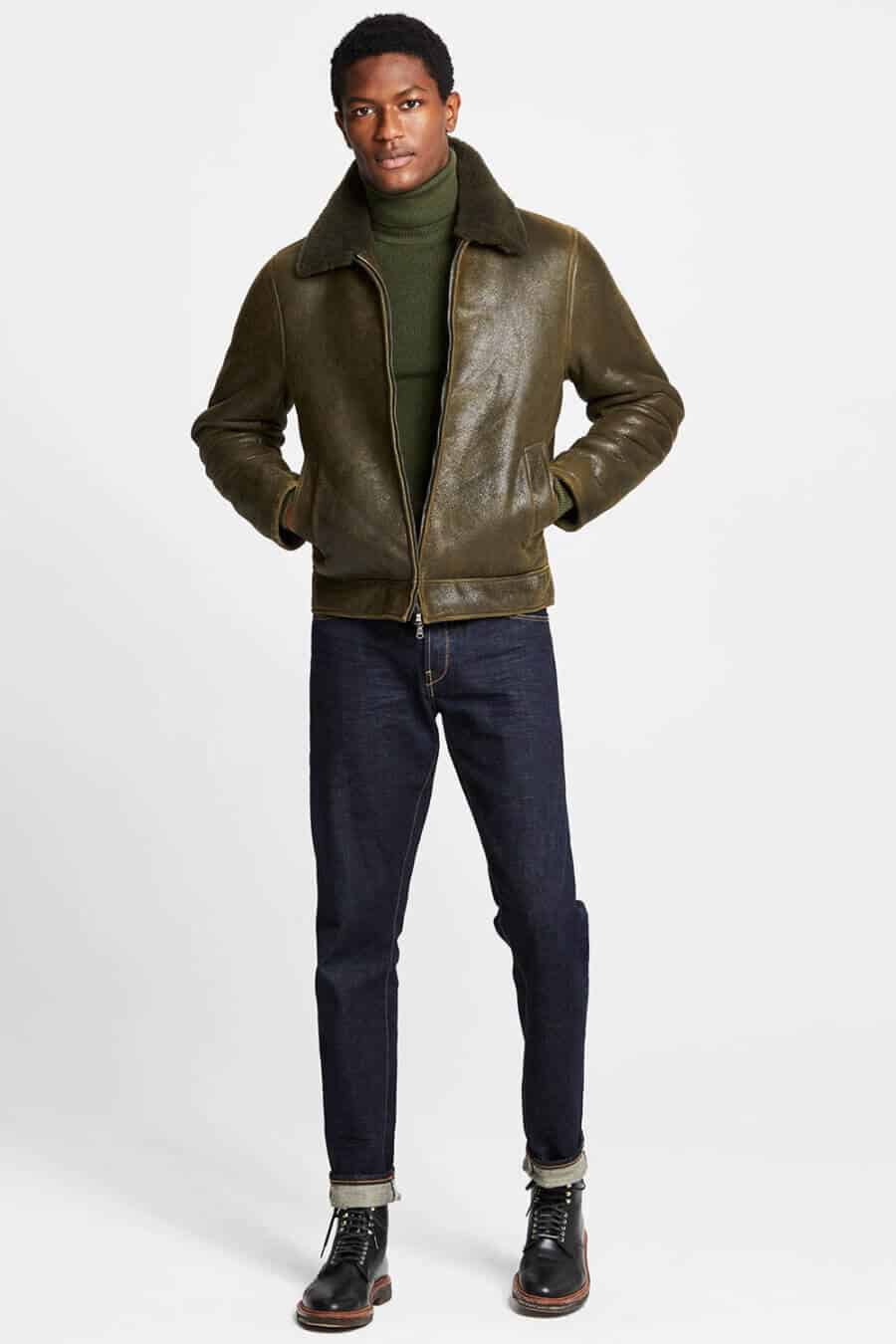 Men's green leather jacket, turtleneck, jeans and boots outfit