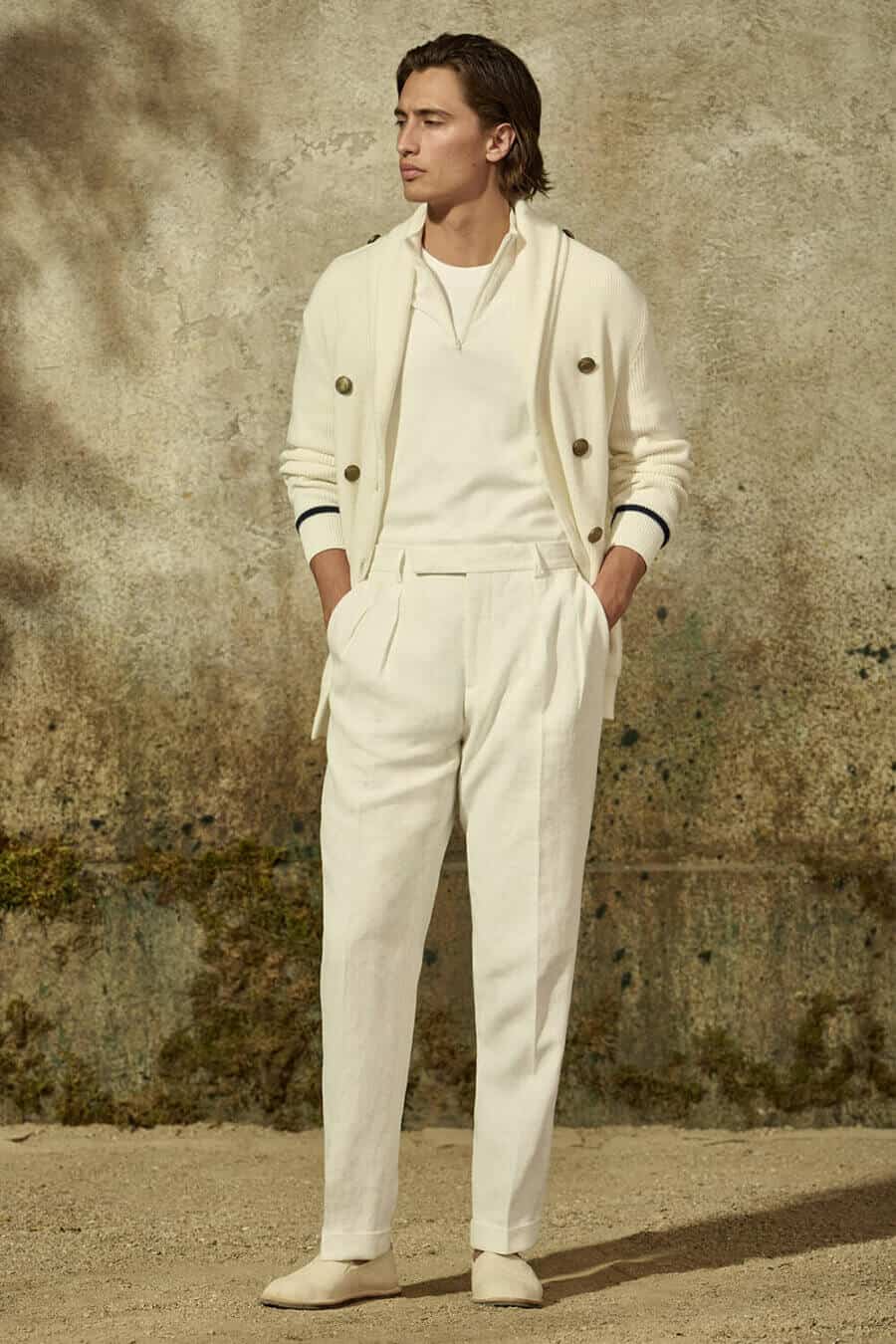 All white outfit for men - white pleated trousers, white half-zip sweater, white cardigan and canvas espadrilles