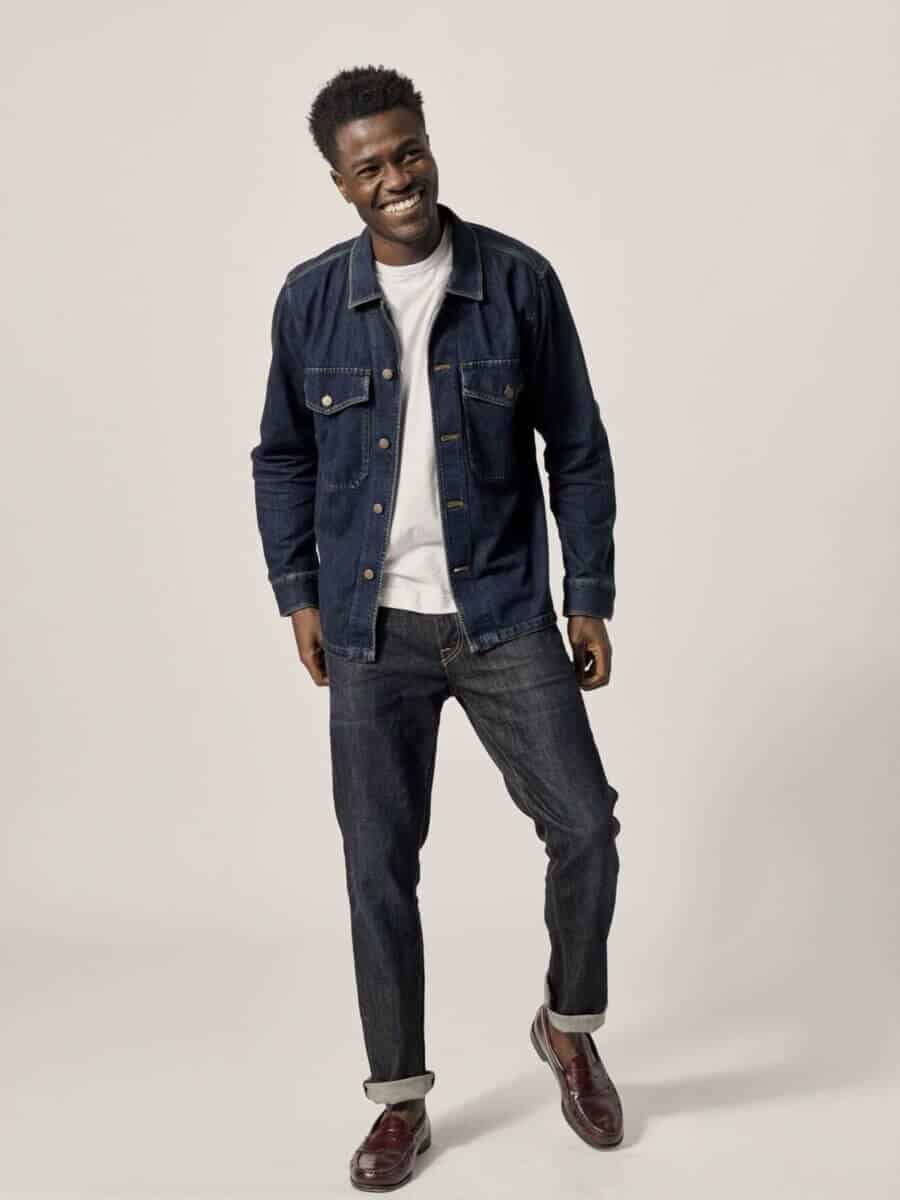 Double denim outfit for men with dark jean jacket and matching jeans