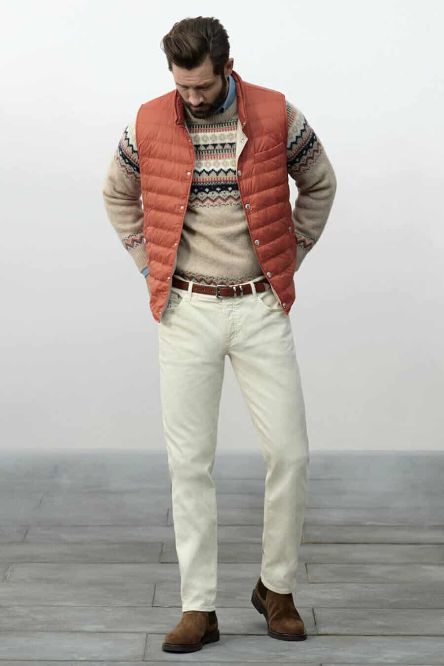 Men's white jeans fall outfit with fair isle jumper and chelsea boots