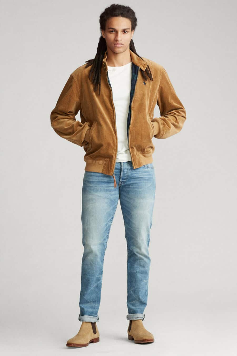 Men's light wash jeans and cord bomber jacket with suede chelsea boots outfit