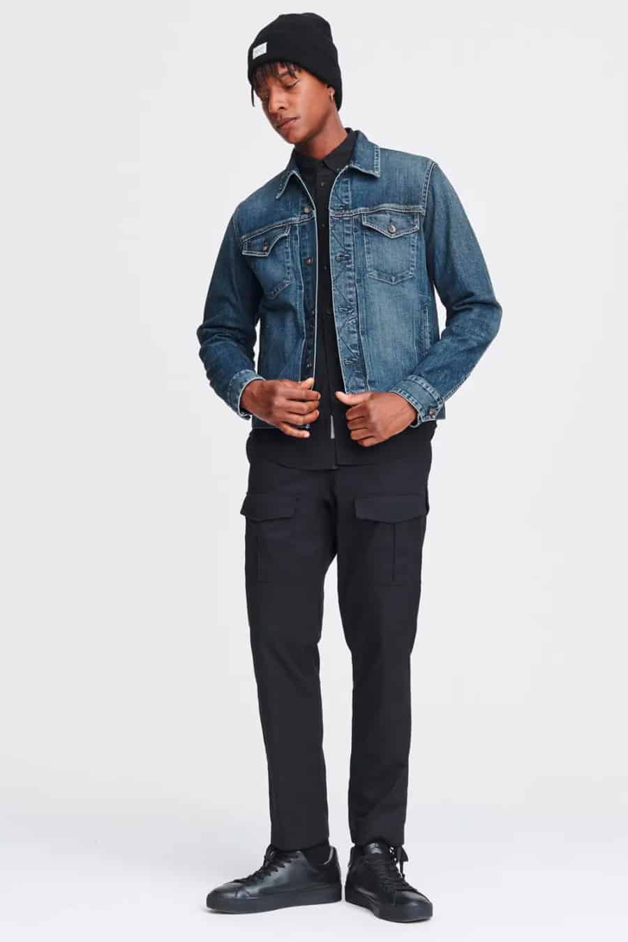 Men's washed jean jacket outfit with black shirt and chinos