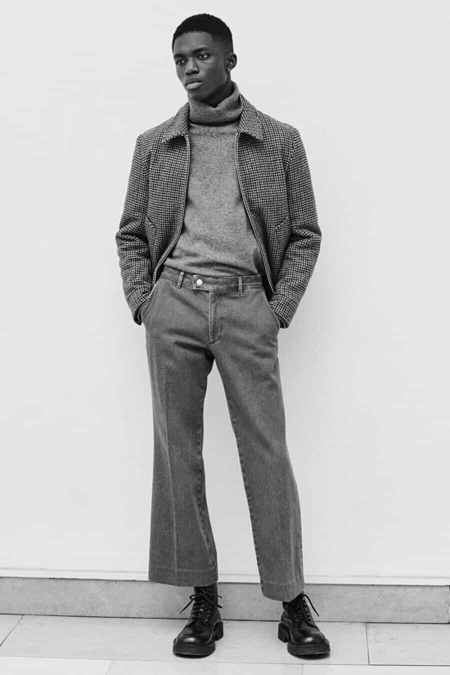 Men's turtleneck 70s inspired outfit with a cropped jacket and flare jeans