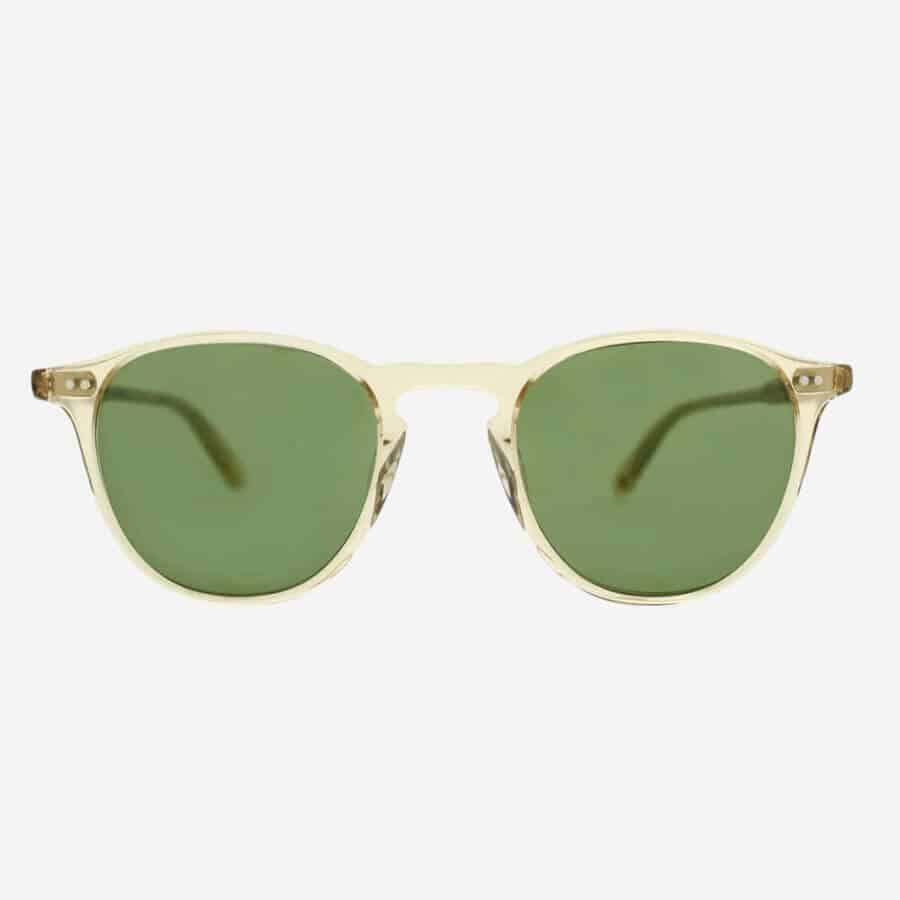 Cool round frame sunglasses by Garrett Leight. Men's clear acetate sunglasses with green lenses