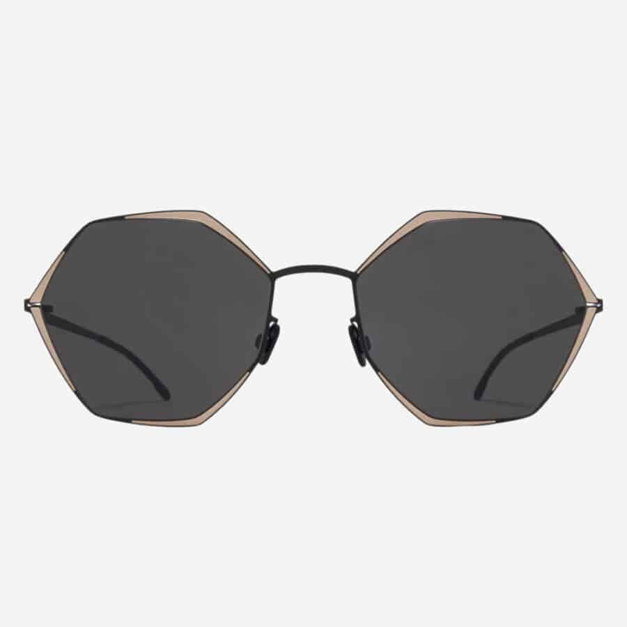 Cool hexagon frame sunglasses for men by Mykita in rose gold with black lenses
