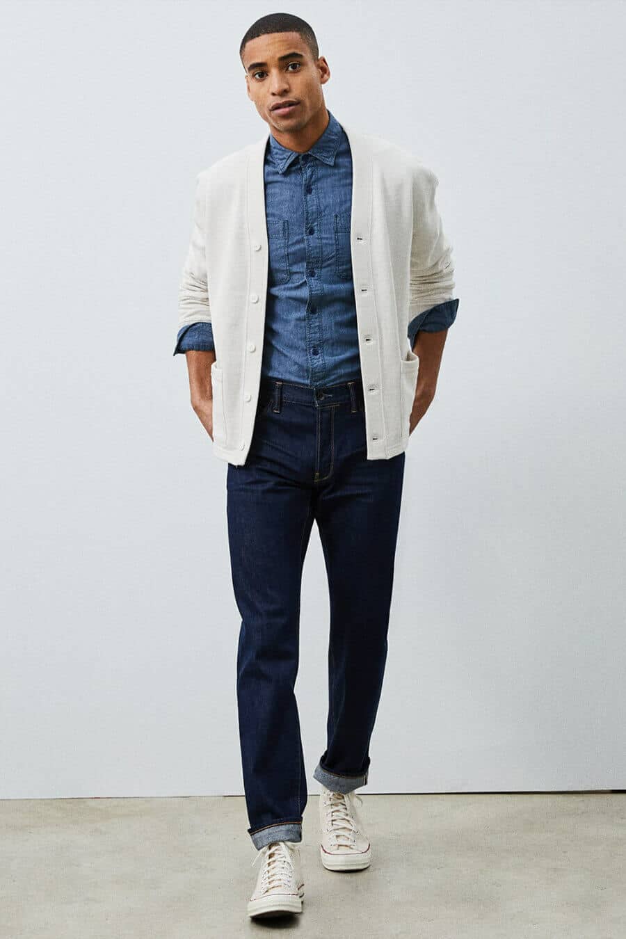 Men's double denim outfit - blue jeans and shirt with white cardigan