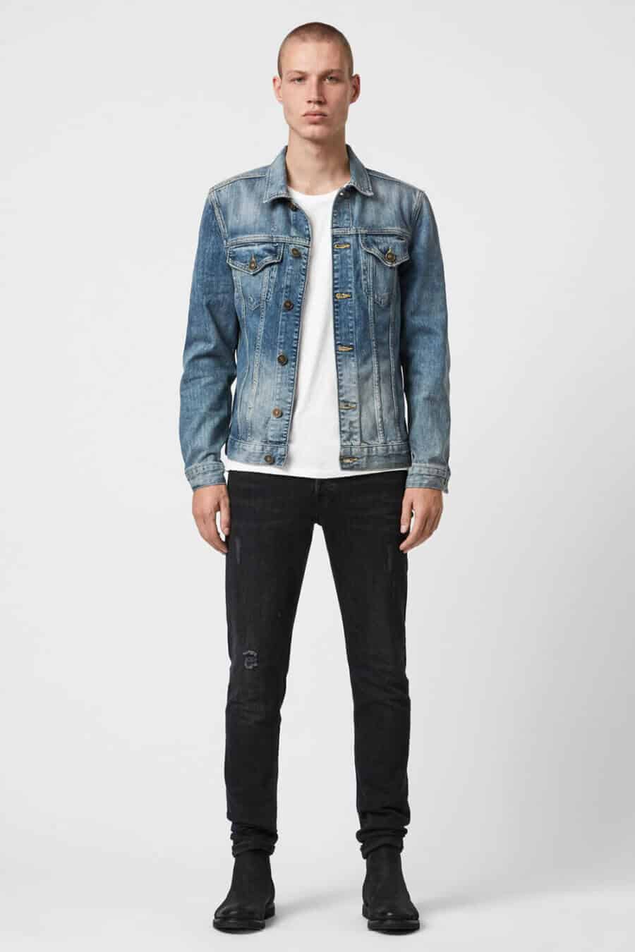 Double denim outfit for men - light wash jacket with black jeans and chelsea boots