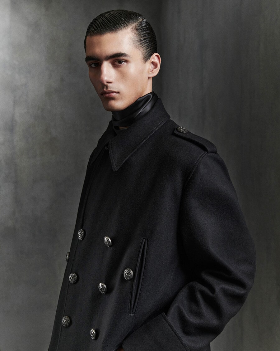 Man wearing black double-breasted Dolce & Gabbana officers coat