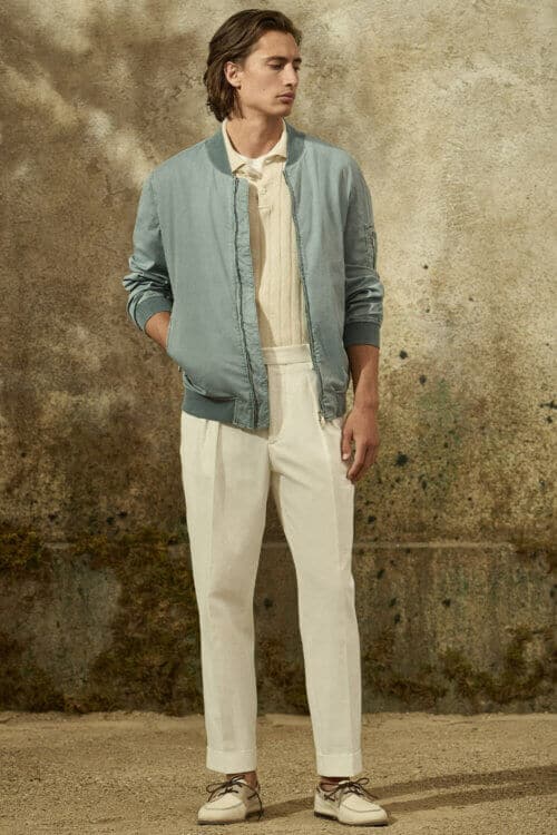 Dress Italian - Men's white pleated trousers with knitted polo shirt and bomber jacket
