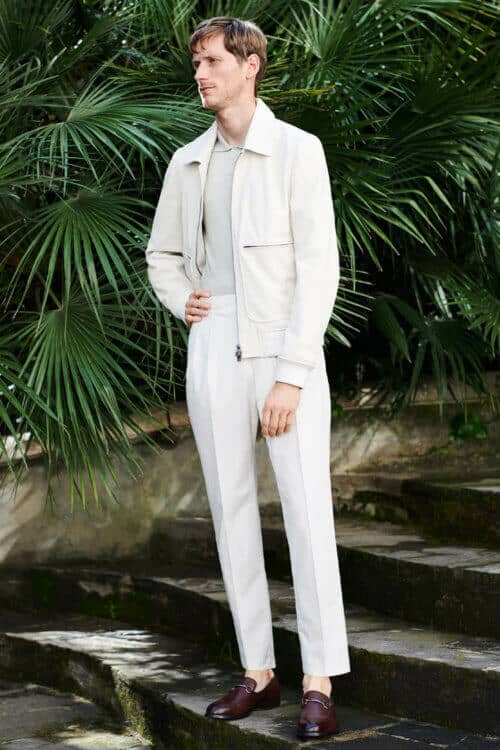 Dress Italian - all white outfit with white pleated trousers and white worker jacket and loafers