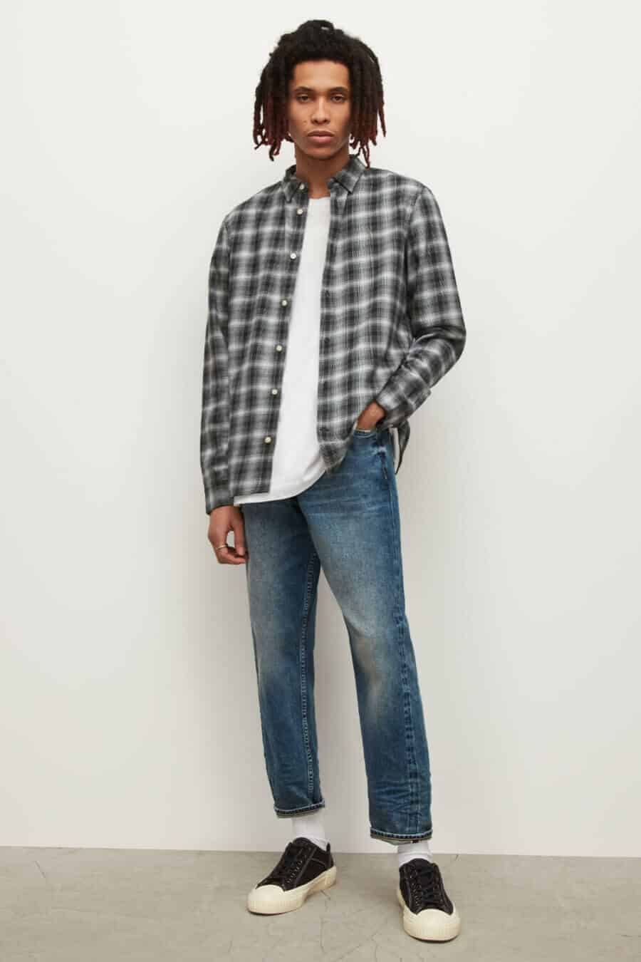 Men's skater flannel shirt outfit with canvas sneakers