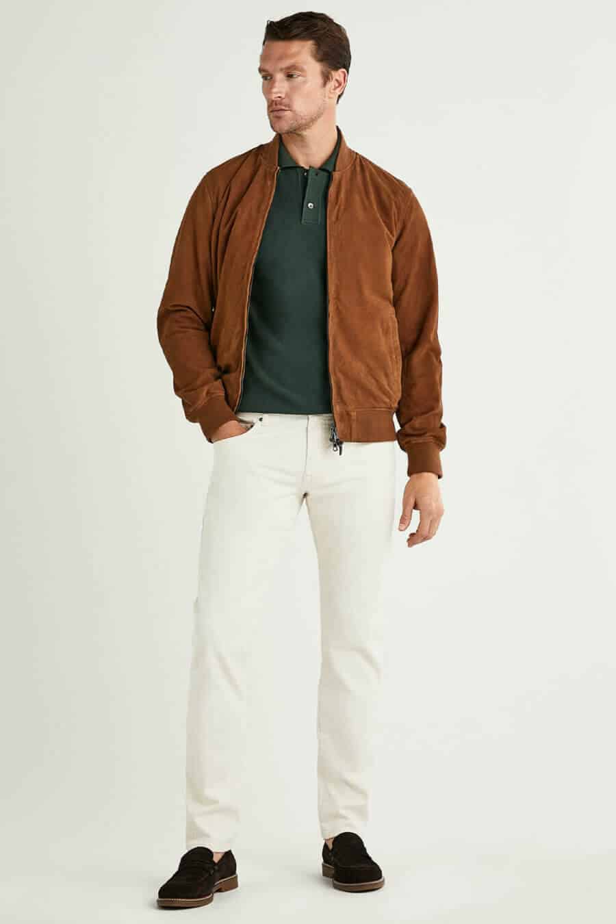 Men's green polo shirt, brown suede bomber and white pants outfit