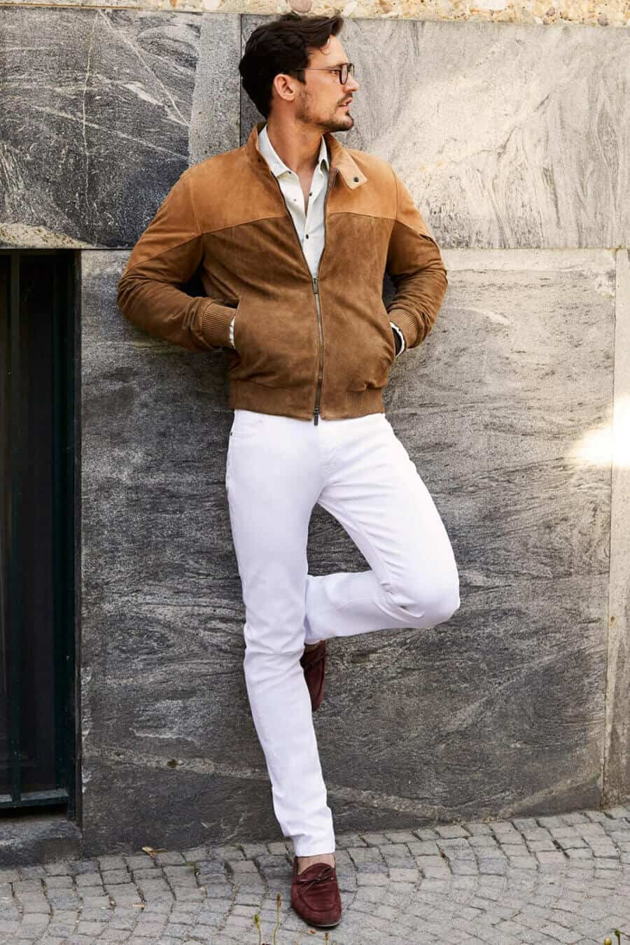 Men's white jeans, brown suede bomber jacket and driving shoes outfit