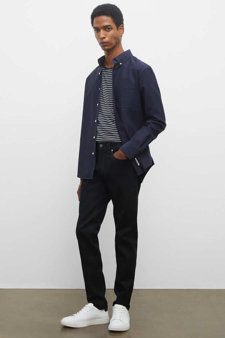 Men's black jeans, white sneakers and navy worker shirt outfit