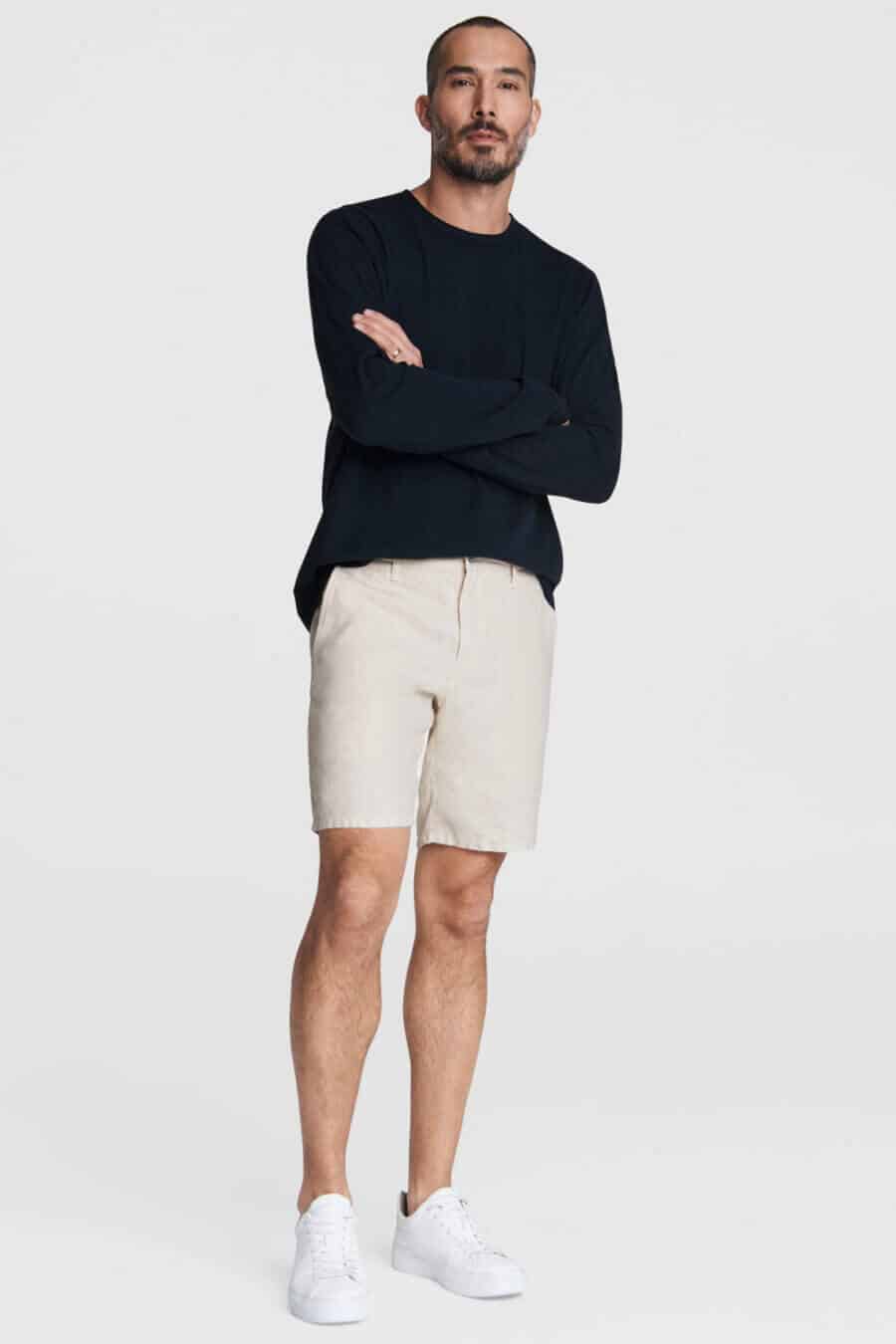 Men's linen shorts with black top and white sneakers outfit