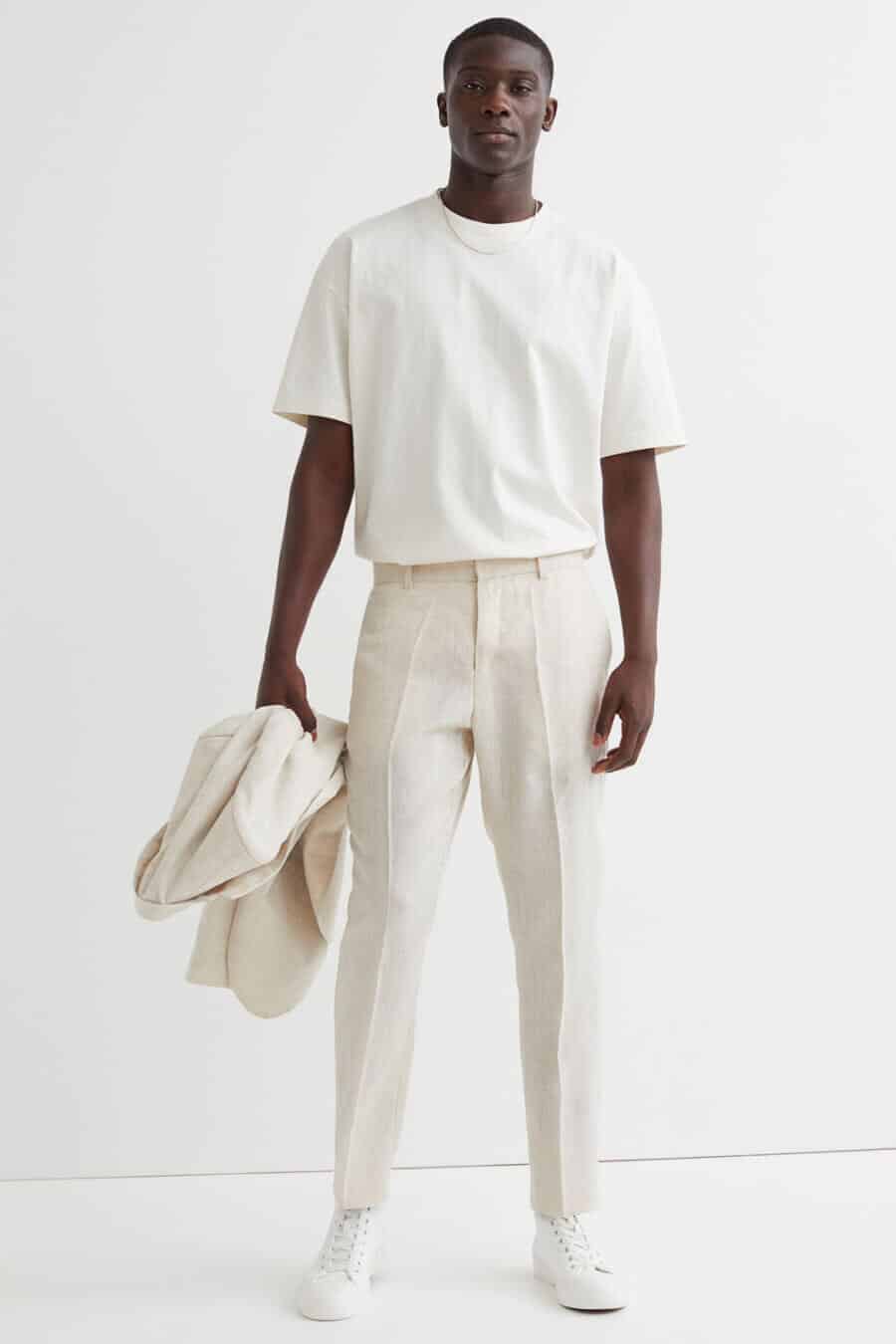 Men's stone linen suit outfit with white T-shirt and white canvas high top sneakers