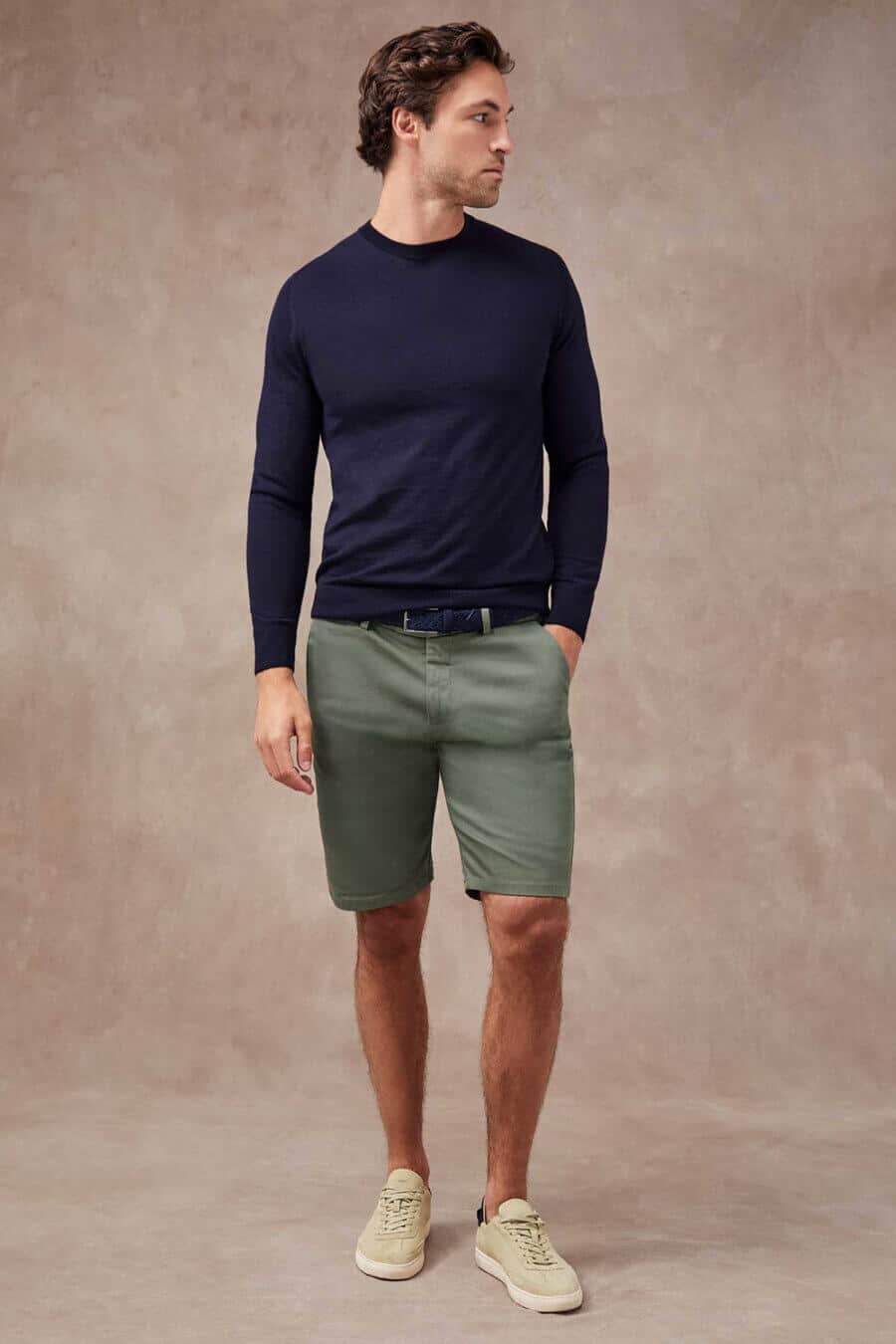 Men's green shorts, blue crew neck and suede sneakers summer outfit