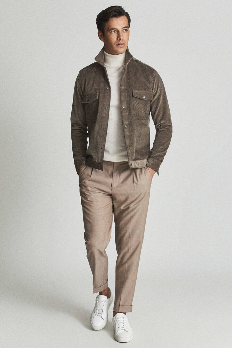 Tonal smart casual khaki pants outfit for men with a turtleneck and suede jacket