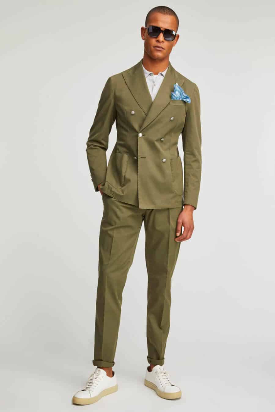 Men's green double breasted suit with white leather sneakers outfit