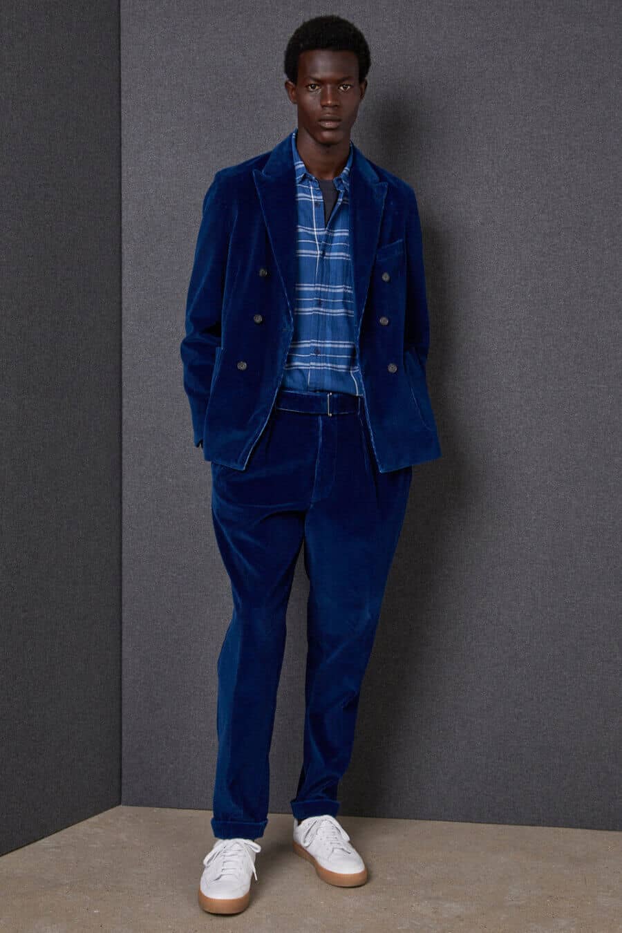 Men's corduroy suit, checked shirt and sneakers outfit