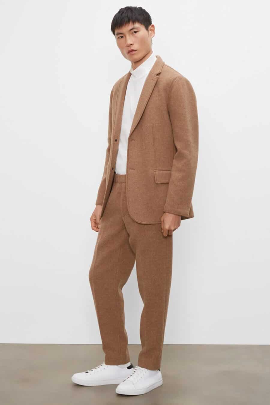 Men's wool brown suit and white turtleneck with white sneakers outfit