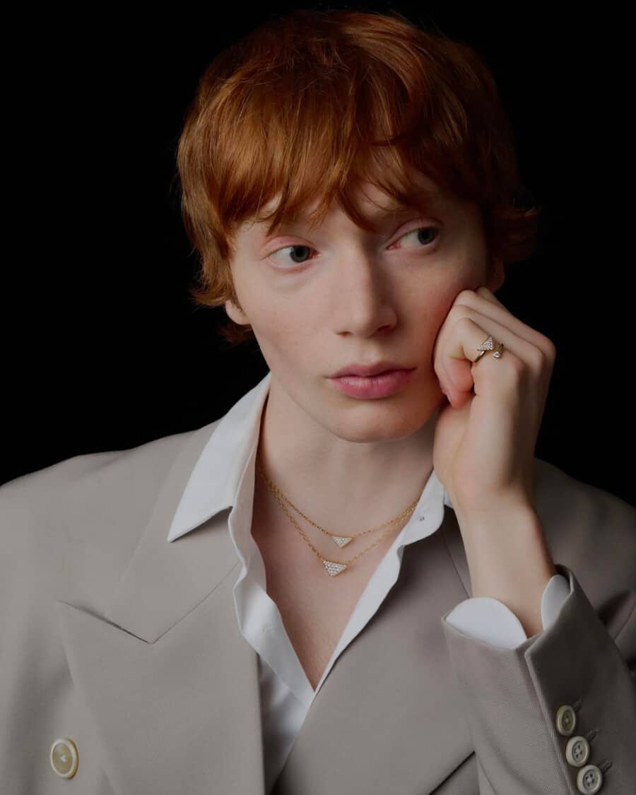 Male model Calum Harper wearing a stone blazer and white shirt