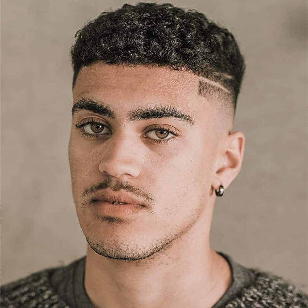Men's Neat curly afro with high skin fade