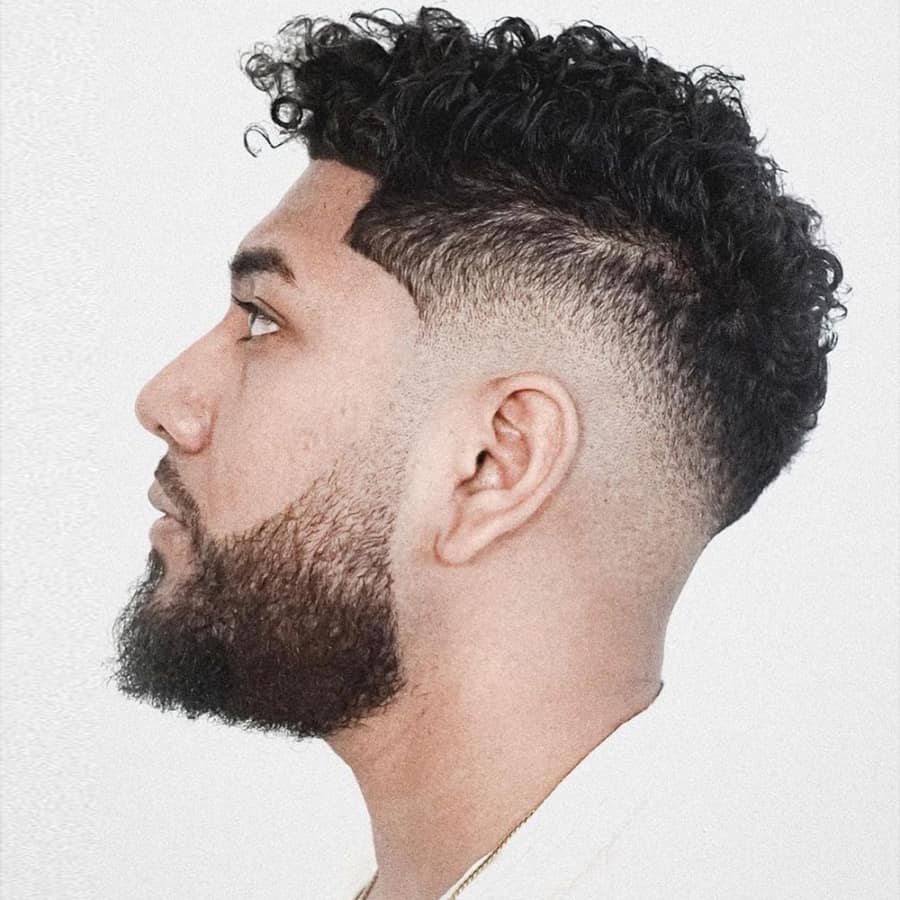 Men's short curly hair with skin fade