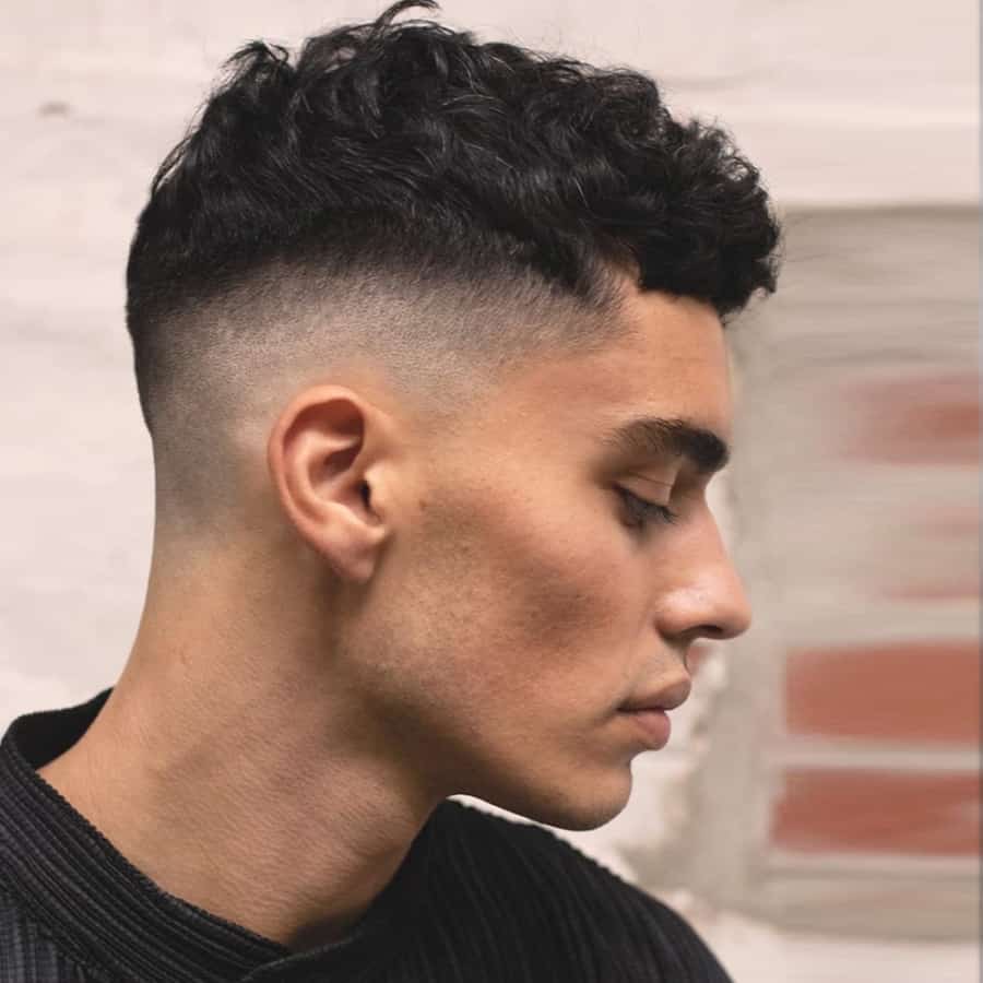 Short, neat curly hair fade for men