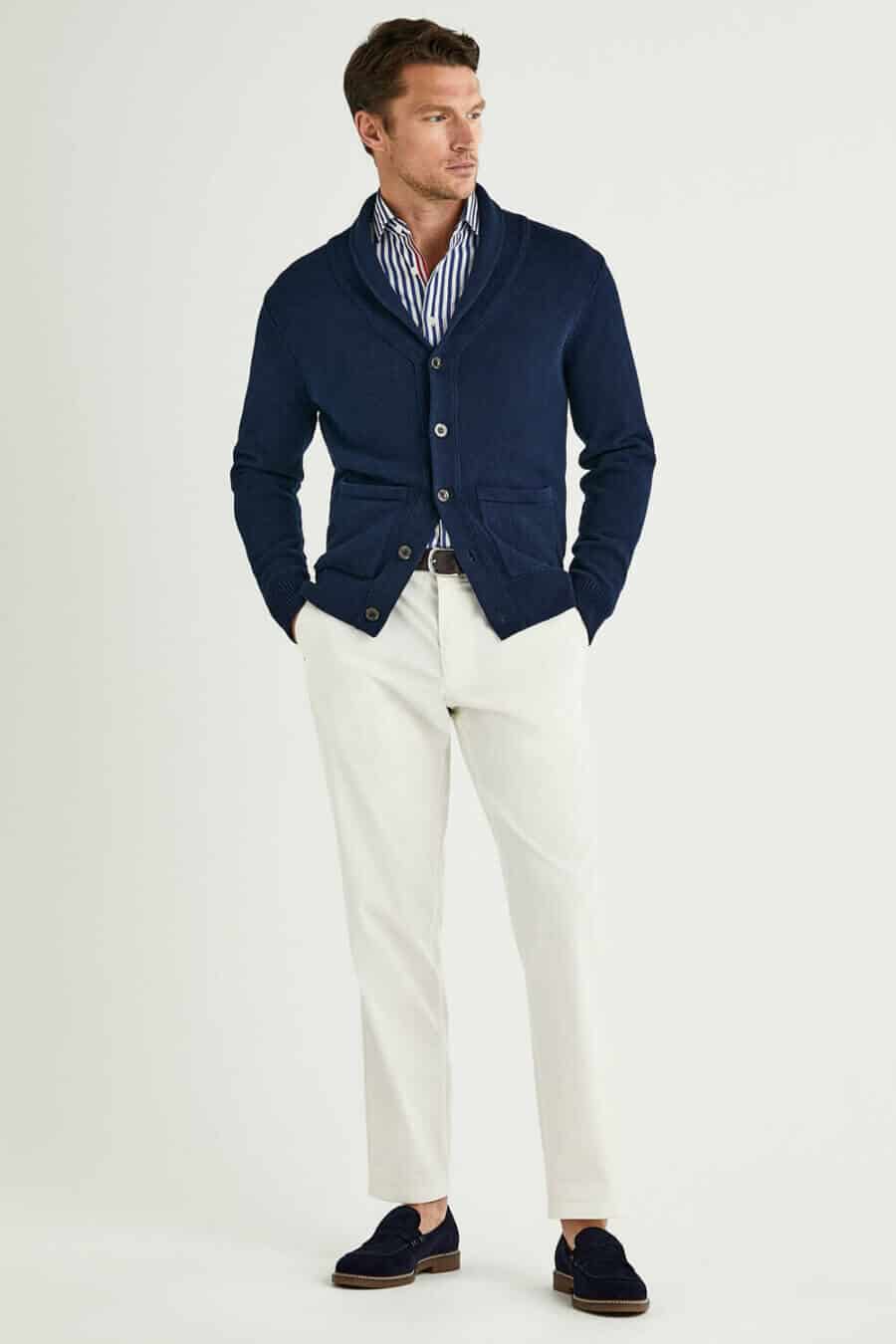 Men's summer shawl collar cardigan, white and blue striped shirt, white trousers and navy suede penny loafers outfit