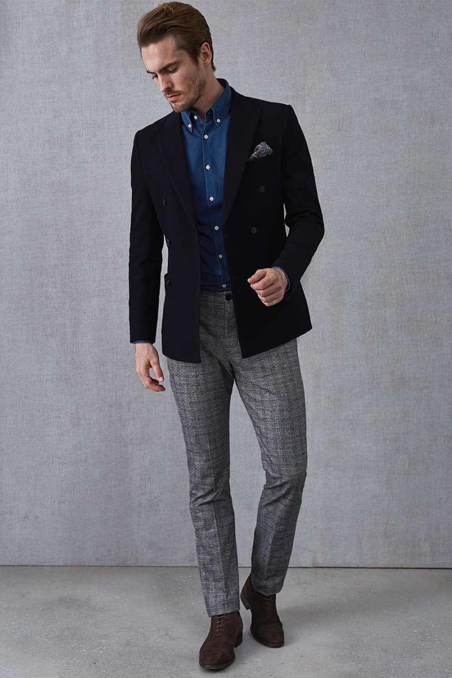 Men's plaid pants, blue Oxford shirt, navy double breasted blazer and suede shoes outfit