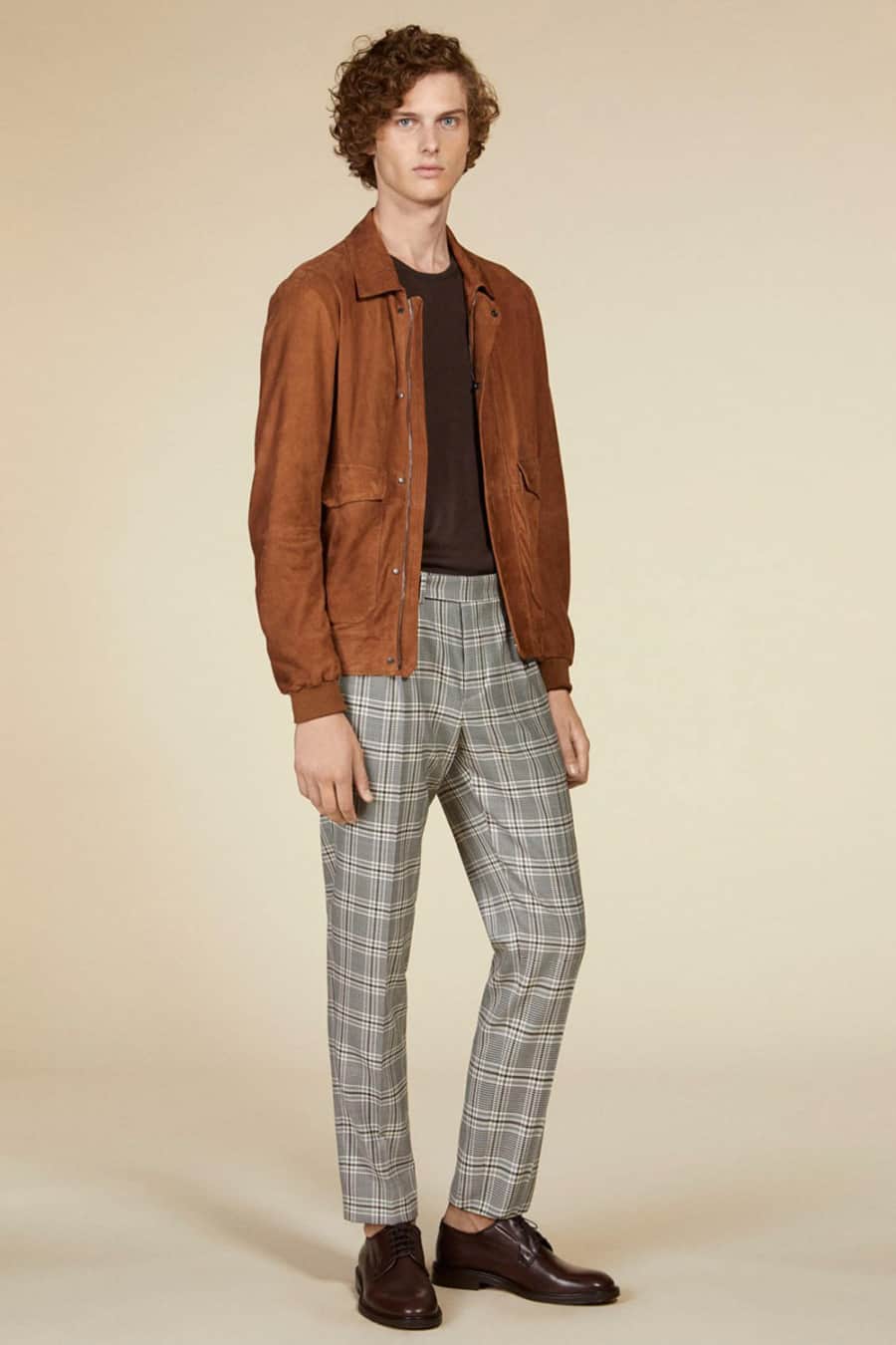 Men's grey plaid pants, brown T-shirt, suede jacket and brown Derby shoes outfit