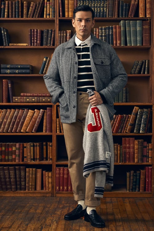 Men's preppy outfit of rugby shirt, herringbone jacket, chinos and loafers