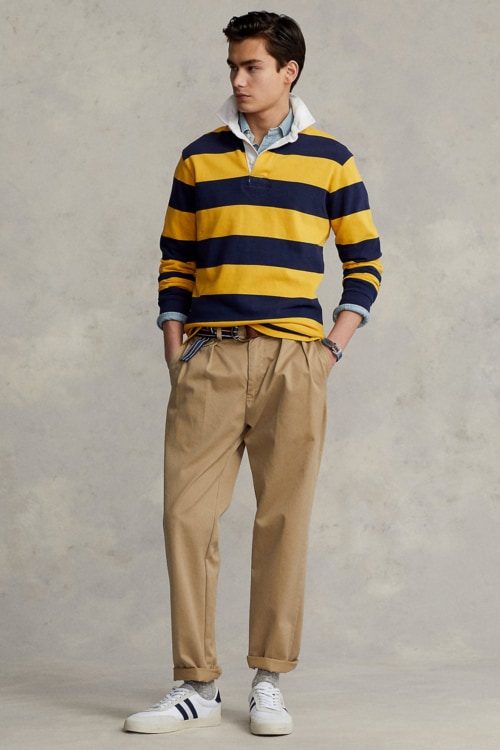 Men's preppy rugby shirt, pleated trousers and sneakers outfit