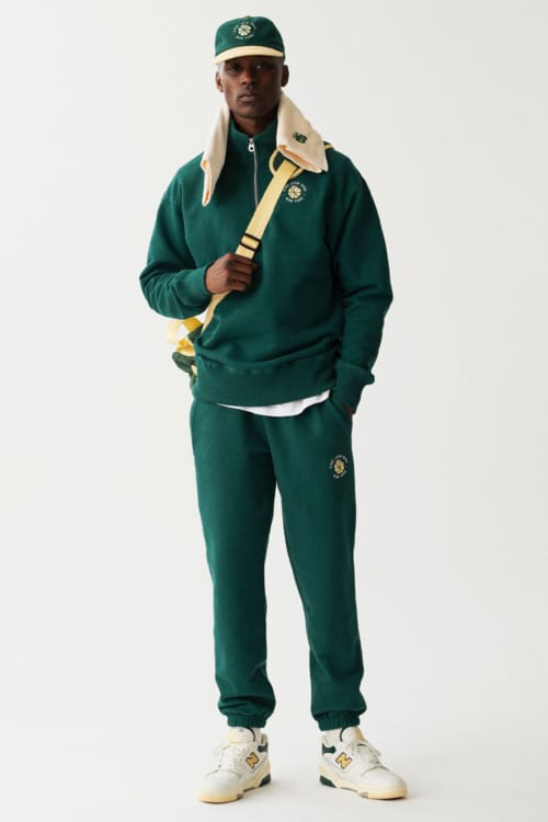 Men's green full tracksuit with sneakers and baseball cap outfit