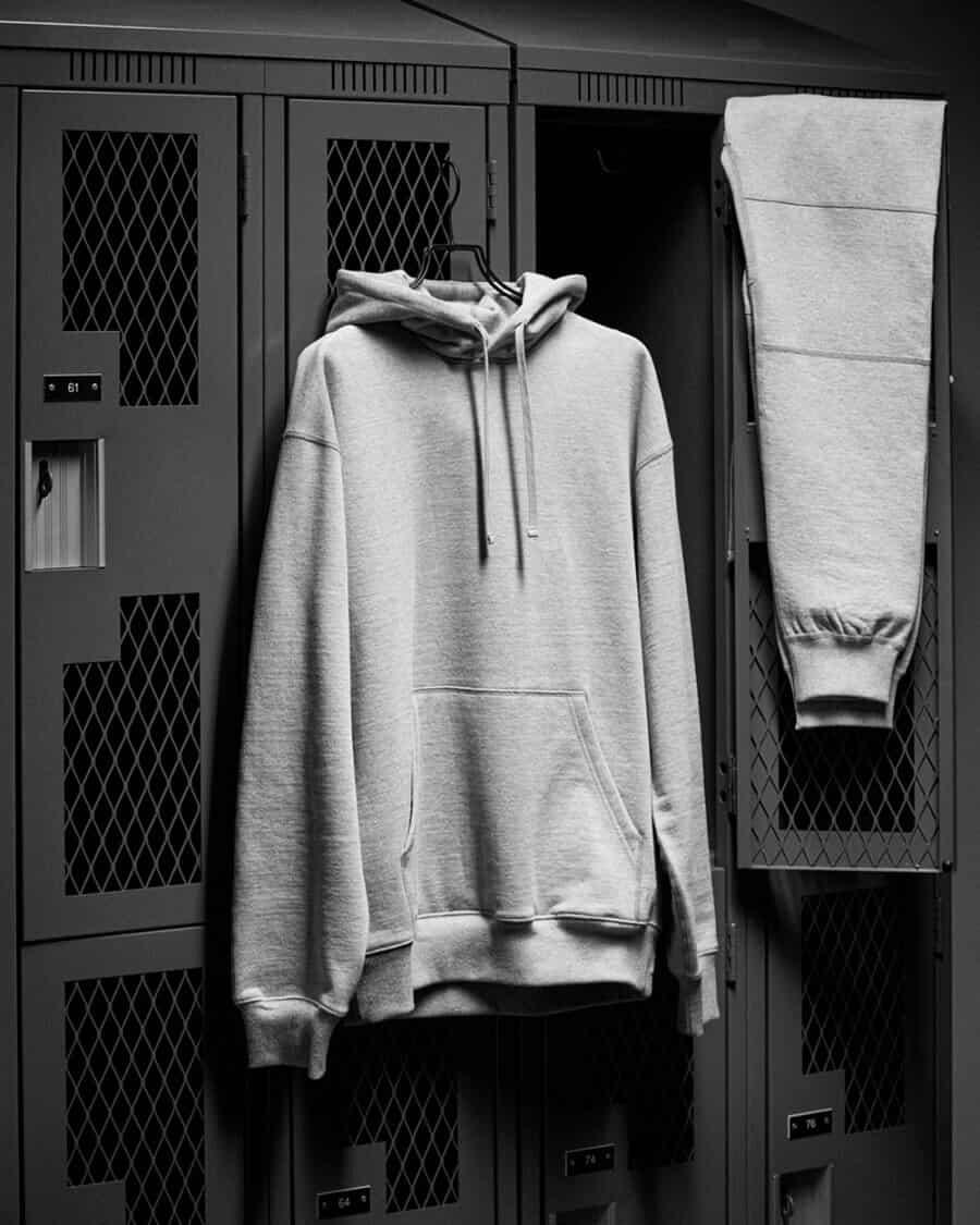 Men's quality grey hoodie handing up in locker room