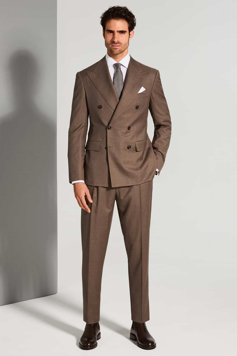 Men's brown suit worn with dark brown Chelsea boots