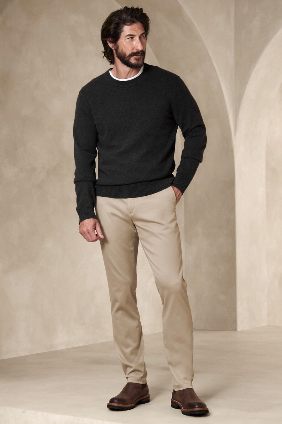 Men's khaki pants, white T-shirt, charcoal sweater and brown leather Chelsea boots outfit