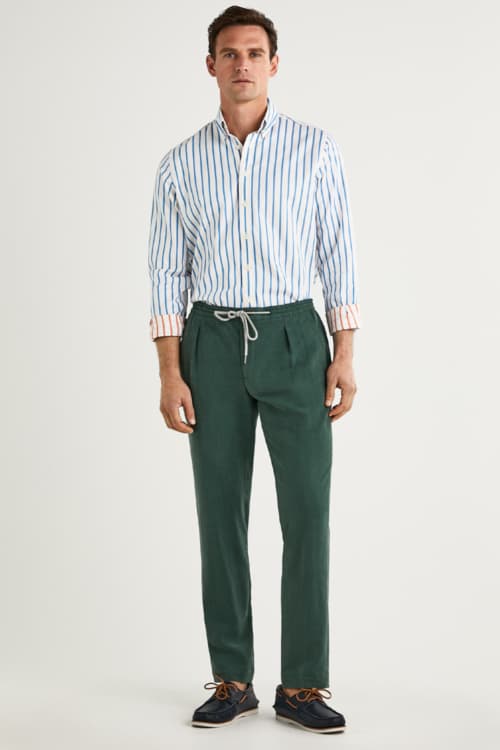 Men's vertical stripe shirt, drawstring trousers and deck shoes outfit