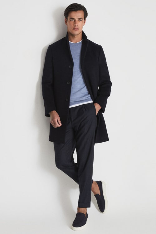 Men's chinos, sneakers, merino wool sweater and overcoat outfit