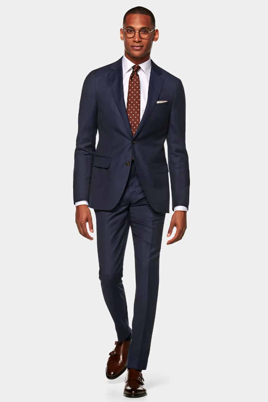 Men's navy suit worn with brown monk-strap shoes