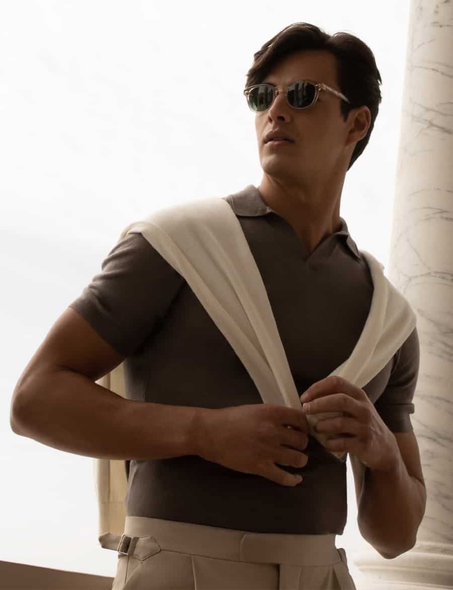 Men's plain polo shirt worn with tailored trousers